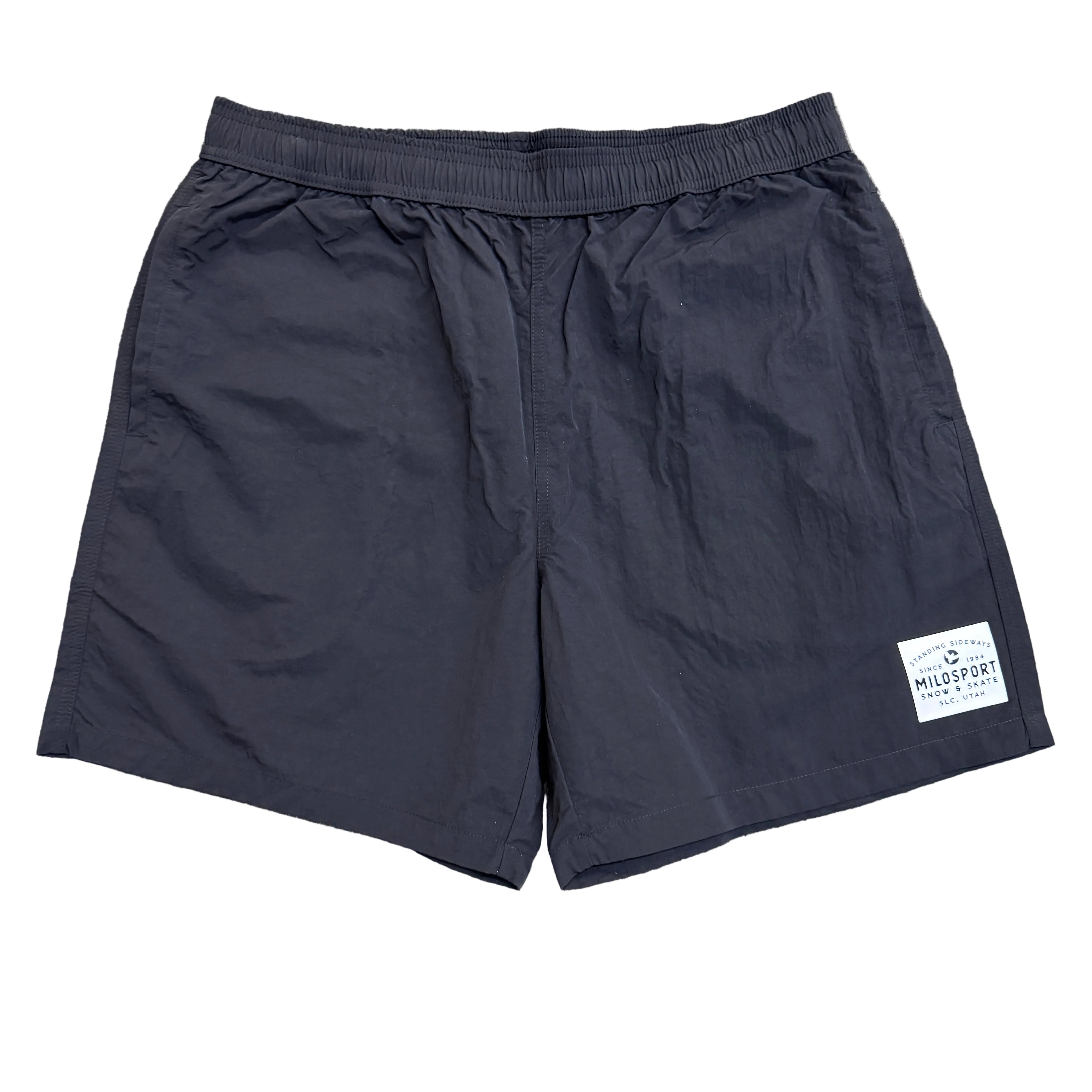 Black Milosport men's swim trunks with sideways patch design, featuring a comfortable fit and stylish look.