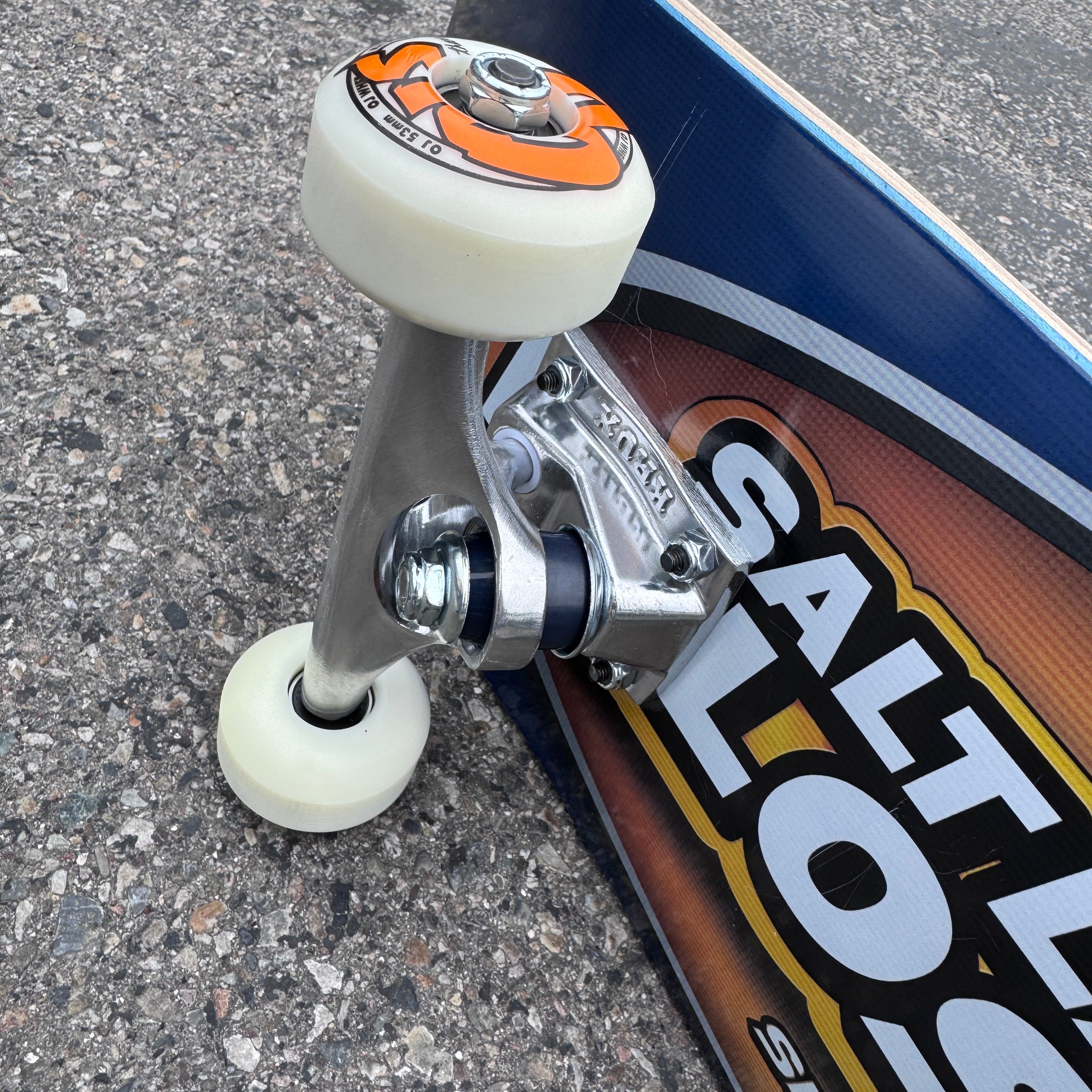 Milosport Pro Skater 801 skateboard complete with Krux trucks and OJ wheels, featuring a deck with colorful graphics and grip tape.