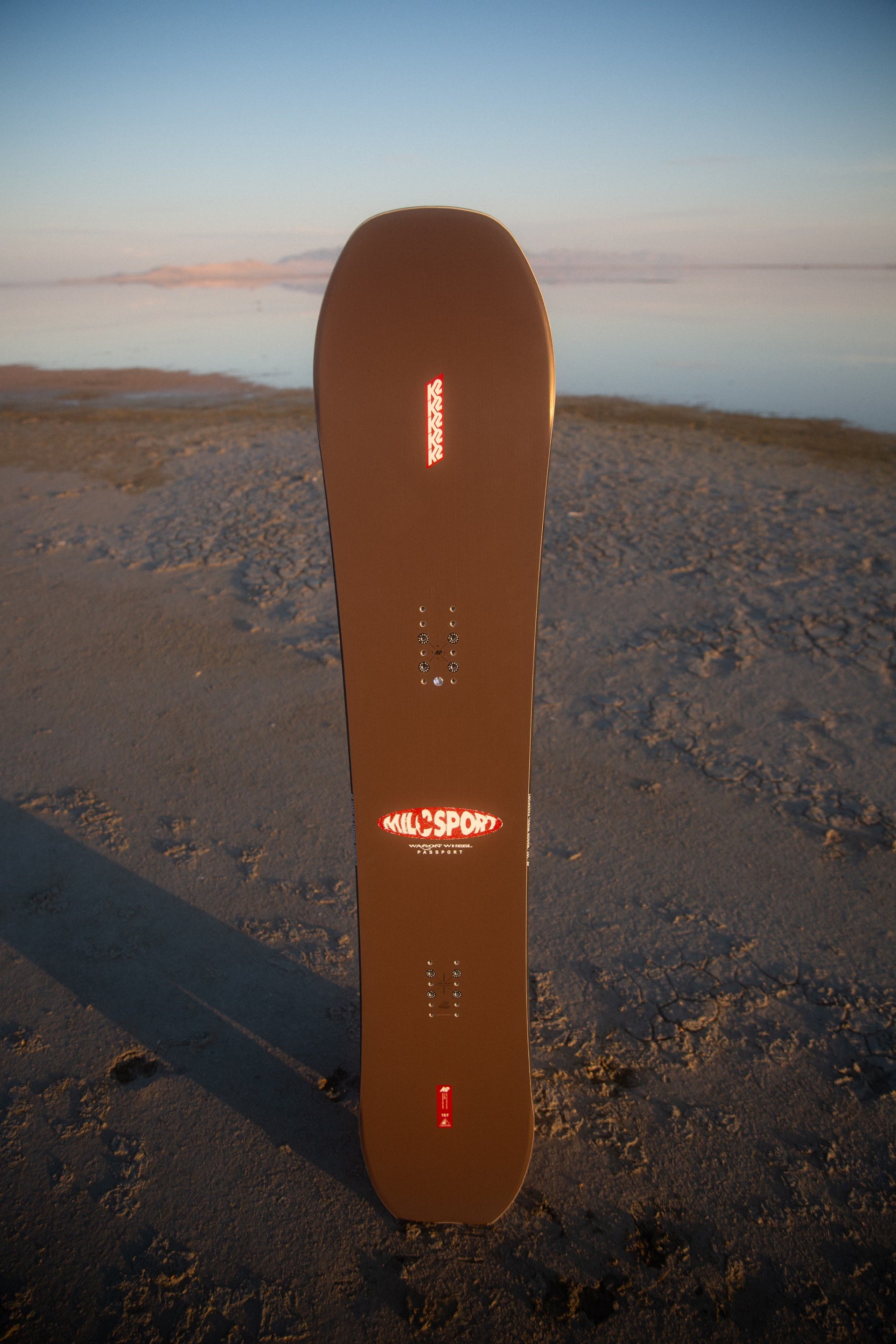 K2 x Milosport Wagon Wheel Passport snowboard for snowboarding, featuring a vibrant design and durable construction.