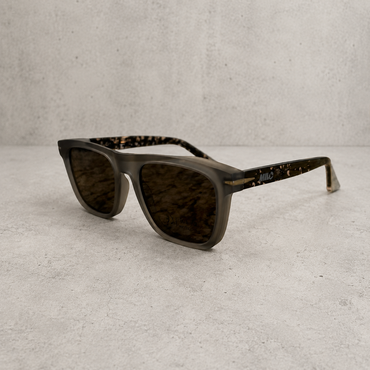 Milosport The Fifty polarized acetate sunglasses with grey tortoise frames and concrete-colored lenses, stylish and UV protective accessories.